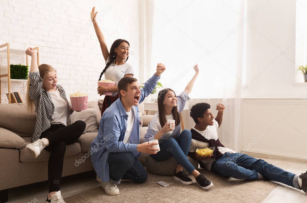 Young football fans. Friends cheering for favourite team