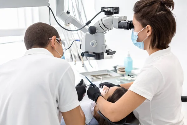 Back view of dentist doctors making dental cleaning — 图库照片