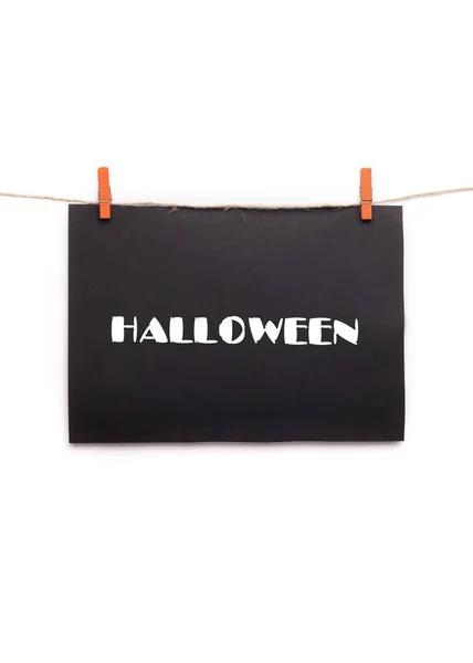 Halloween banner with white text hanging on rope — Stock Photo, Image