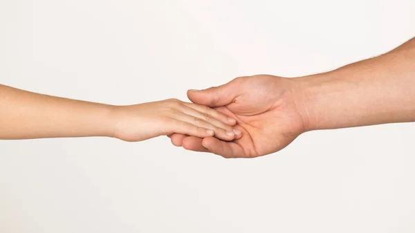 Father taking his little kid gently by the hand — Stock Photo, Image