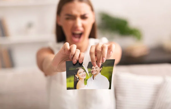 Angry Woman Ripping Photo With Ex-Husband Indoor — Stock Photo, Image