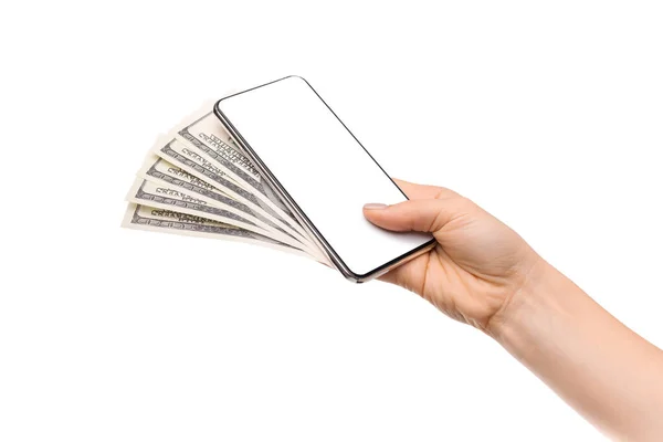 Female hand holding cellphone with blank screen and dollars — Stock Photo, Image