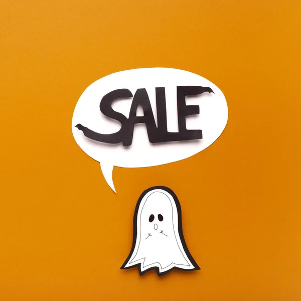 Halloween ghost saying word in speech bubble on orange — Stock Photo, Image