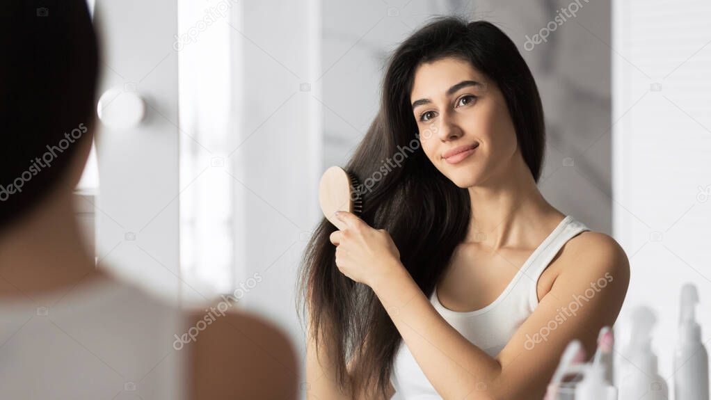 Girl Brushing Hair Standing In Bathroom, Panorama