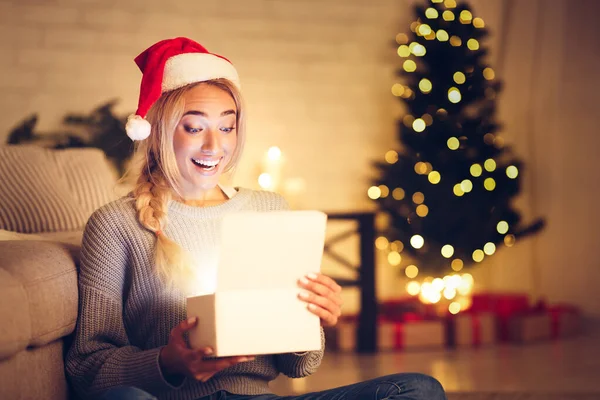 Christmas miracle. Surprised woman opening gift box — Stock Photo, Image