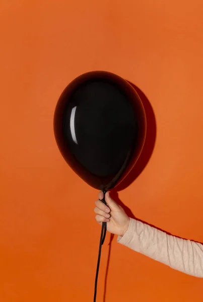 Black creepy halloween balloon with copy space for text