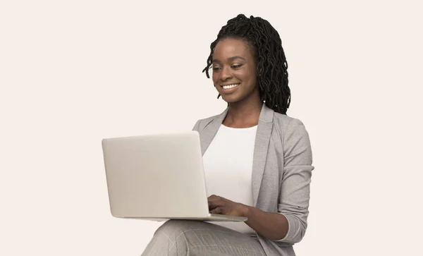 African American Girl Working On Laptop Sitting Over White Background — Stock Photo, Image