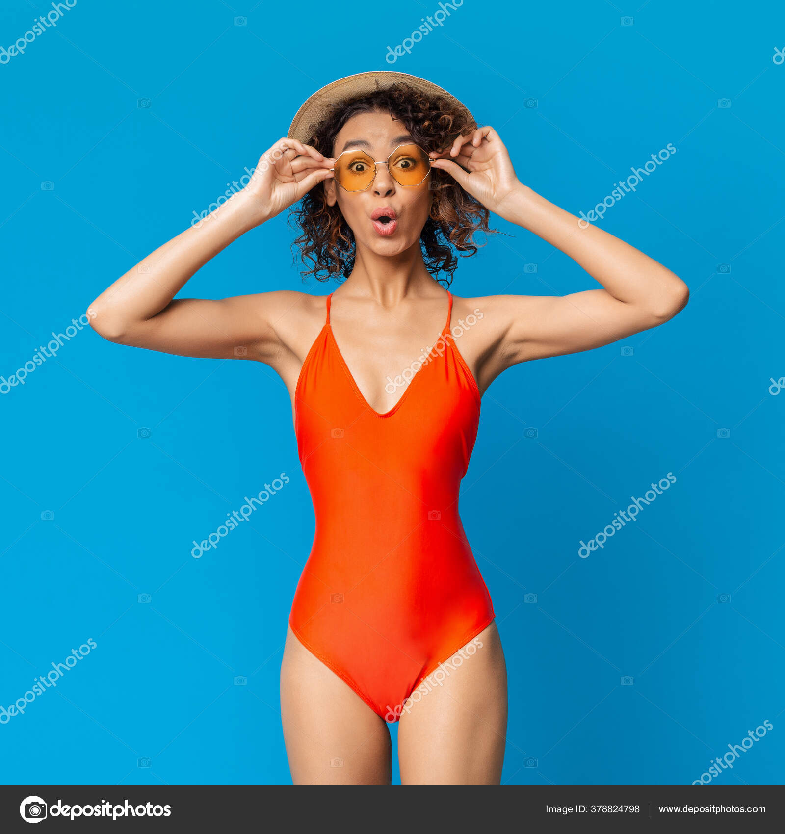 Summer Sale. Shocked african girl in swimsuit taking off sunglasses in  amazement Stock Photo by ©Milkos 378824798