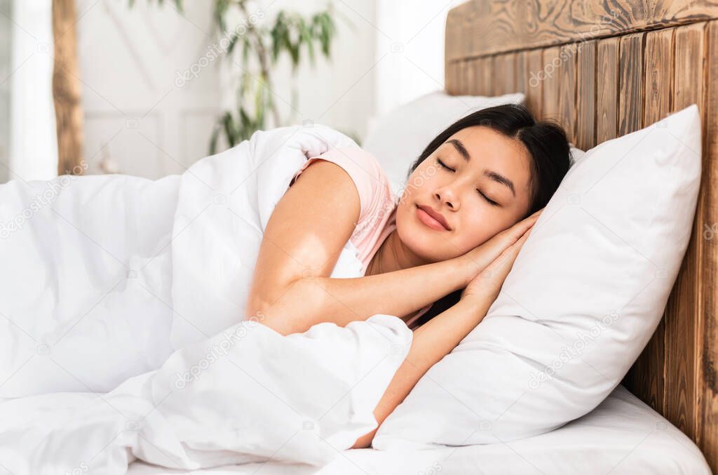 Peaceful Asian Girl Sleeping Resting Lying In Bedroom