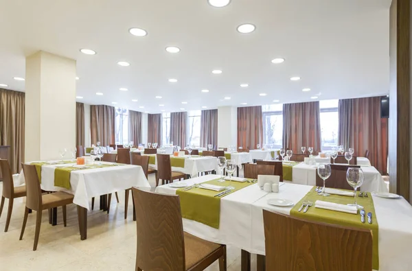 Brown curtains in restaurant with serving tables — Stock Photo, Image