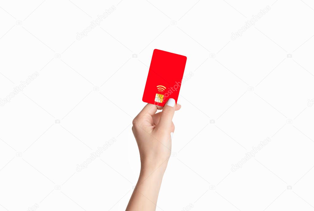 Contactless payment concept. Female hand holding credit card on white background, closeup