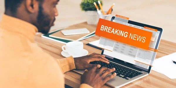 African American man reading BREAKING NEWS on laptop screen, collage — Stock Photo, Image