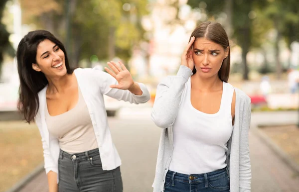 Shy Girl Avoiding Meeting Friend Having Communication Problems Walking Outdoors — Stock Photo, Image