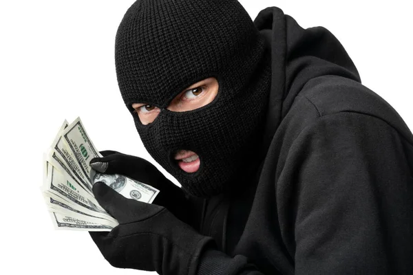 Masked thief counting money isolated over white wall — Stock Photo, Image