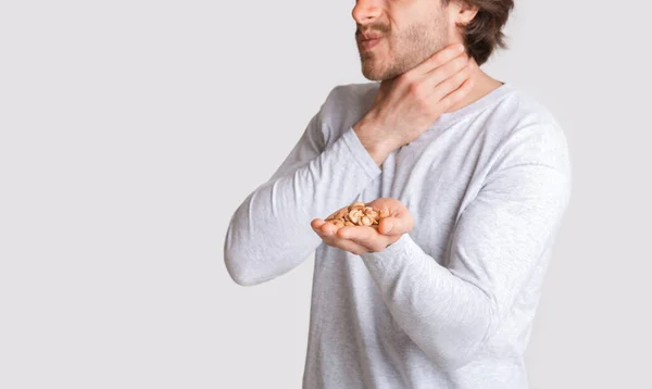 Health problems and food allergies. Man suffocates from nuts — Stock Photo, Image