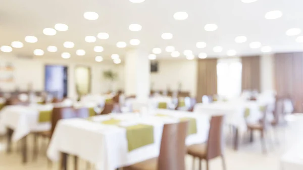 Blurred photo of brightly lit dining room — Stock Photo, Image