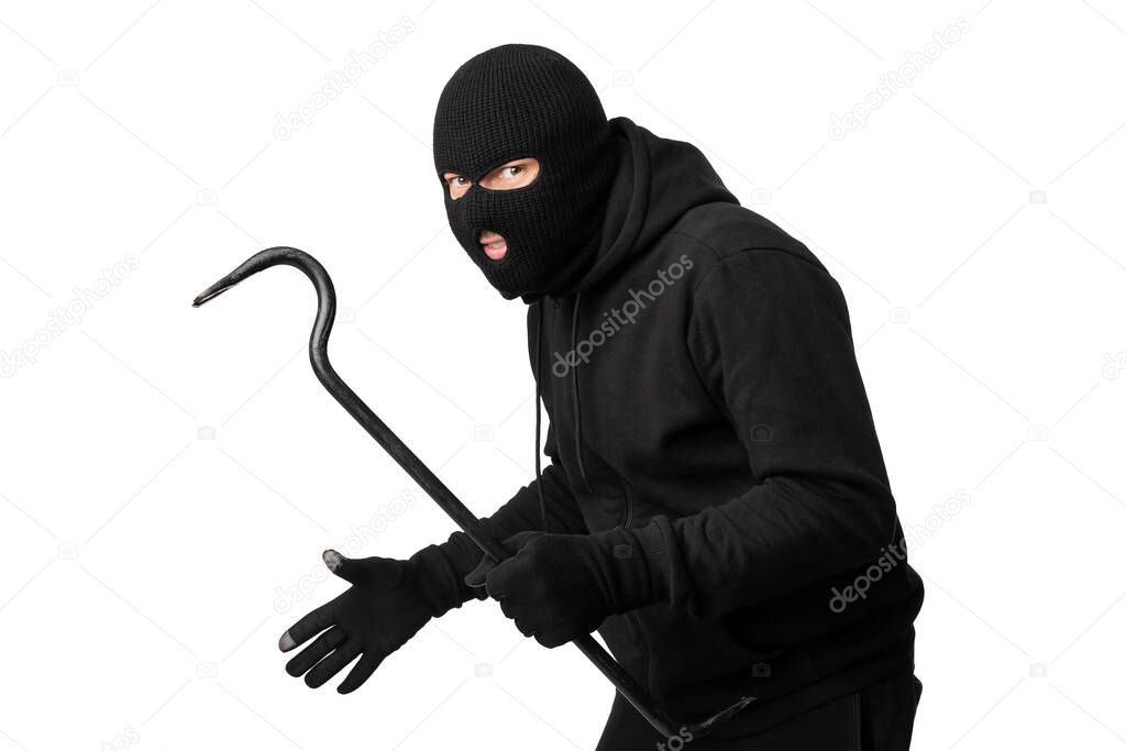 Portrait of masked thief with crowbar isolated over white wall