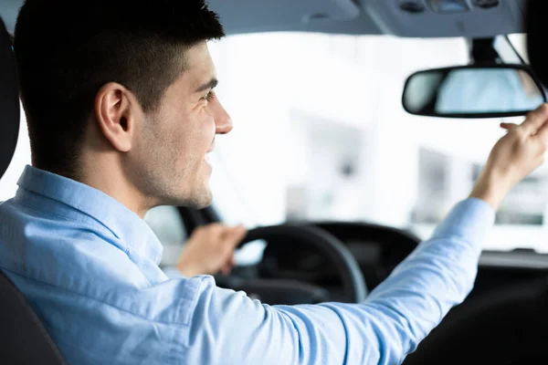 Guy Checking Rareview Mirror Sitting In Drivers Seat — Stock Photo, Image