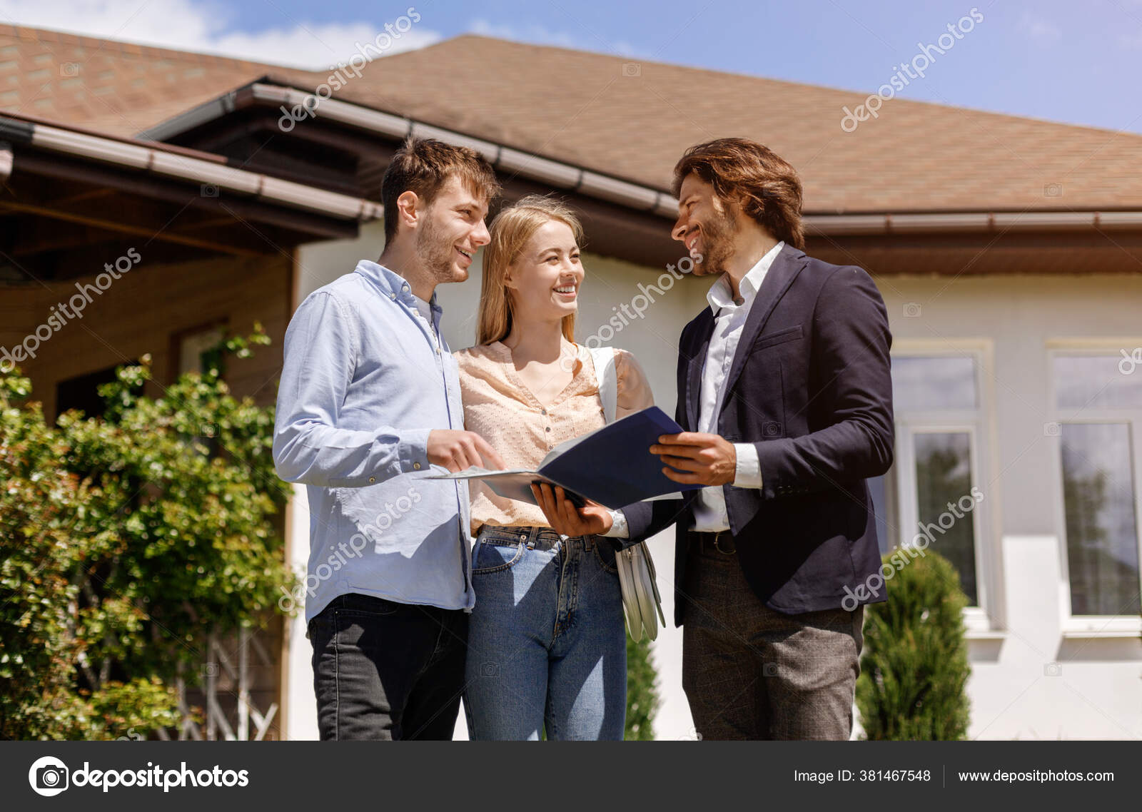 Real Estate Agent With House And Schlü Stock Photo, Picture and