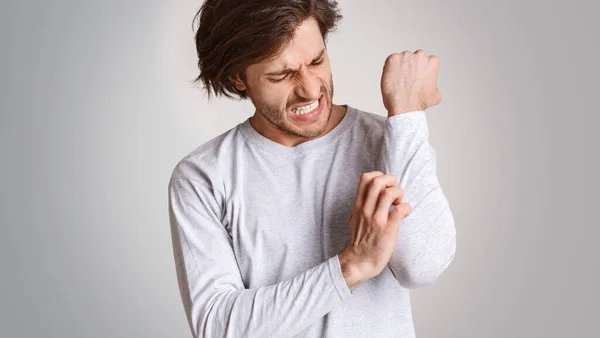 Skin irritation and itching. Man expression of pain, suffers from allergies or insect bites — Stock Photo, Image