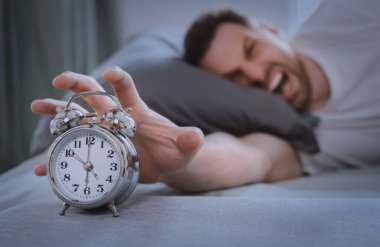 Mad Guy Shouting Waking Up Turning Off Alarm-Clock Indoors clipart