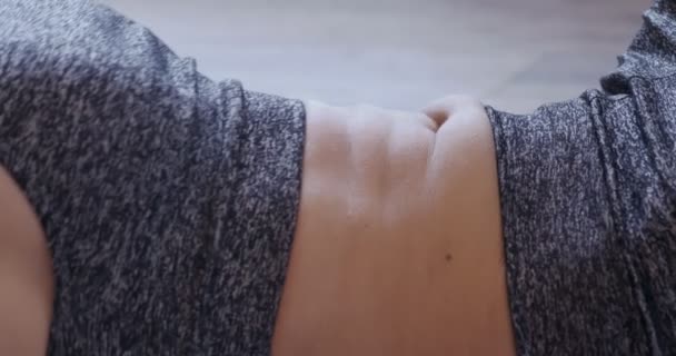 Extreme close-up of woman doing abdominal exercise — Stock Video