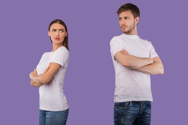 Offended couple standing back to back ignoring each other