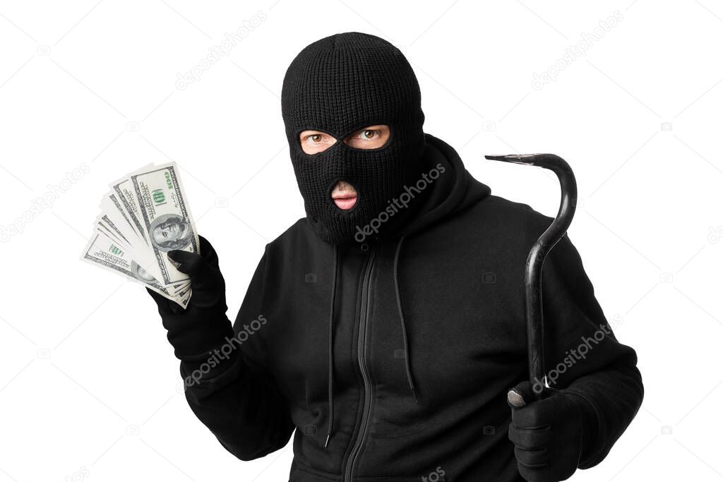 Masked thief holding money isolated over white wall