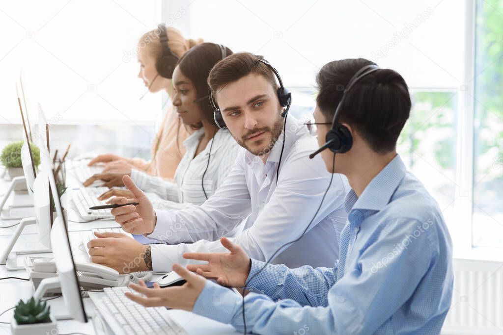 Customer support department team at work in call centre office