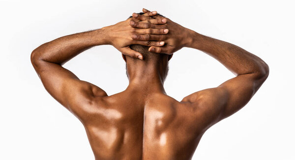 Bodybuilding Concept. Muscular African American Man Posing Showing Perfect Body Standing Back To Camera On White Studio Background. Panorama