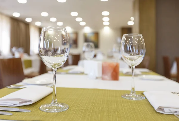 Focus on empty wine glass on napkin, near candle — Stock Photo, Image