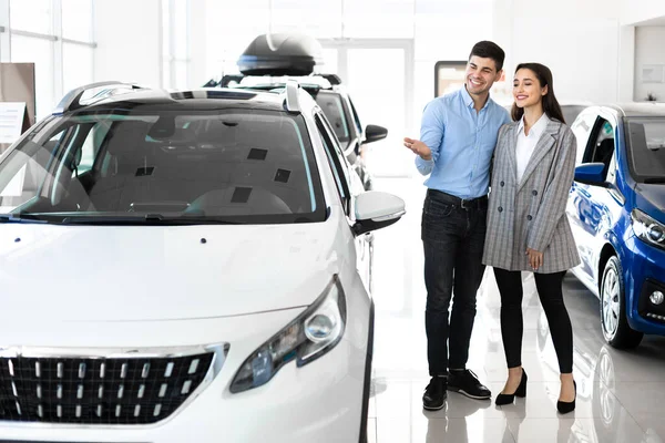 Young Couple Ponting At Brand New Auto — Stock Photo, Image