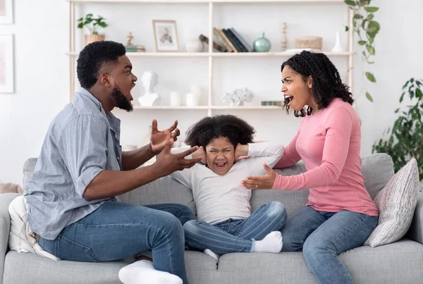 Little Afro Girl Covering Ears Not To Listen Mom And Dad Quarrel — Stock Photo, Image