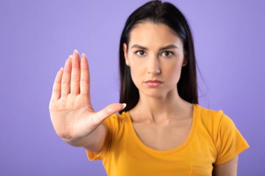 Serious girl showing stop sign with hand clipart