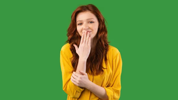 Girl Laughing Covering Mouth Standing Over Green Studio Background, Panorama — Stock fotografie