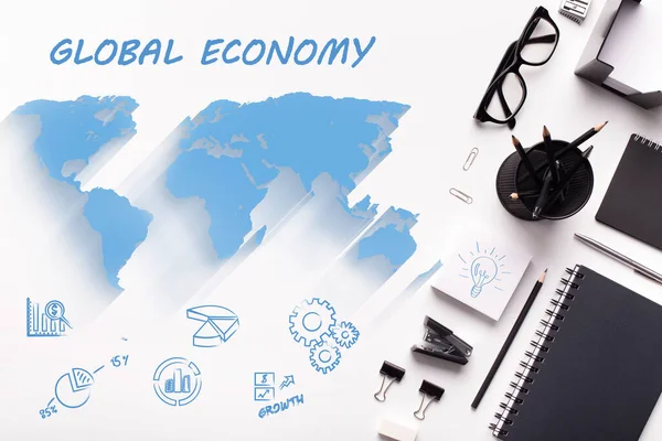 Global economy. Overhead view of office stationery, business icons and world map on white background, collage — Stock Photo, Image