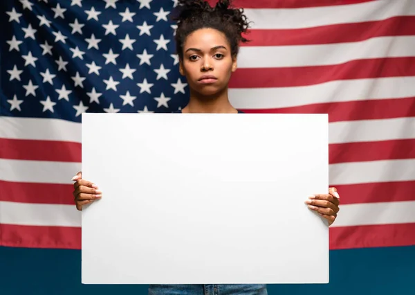 African american woman protesting with blank placard