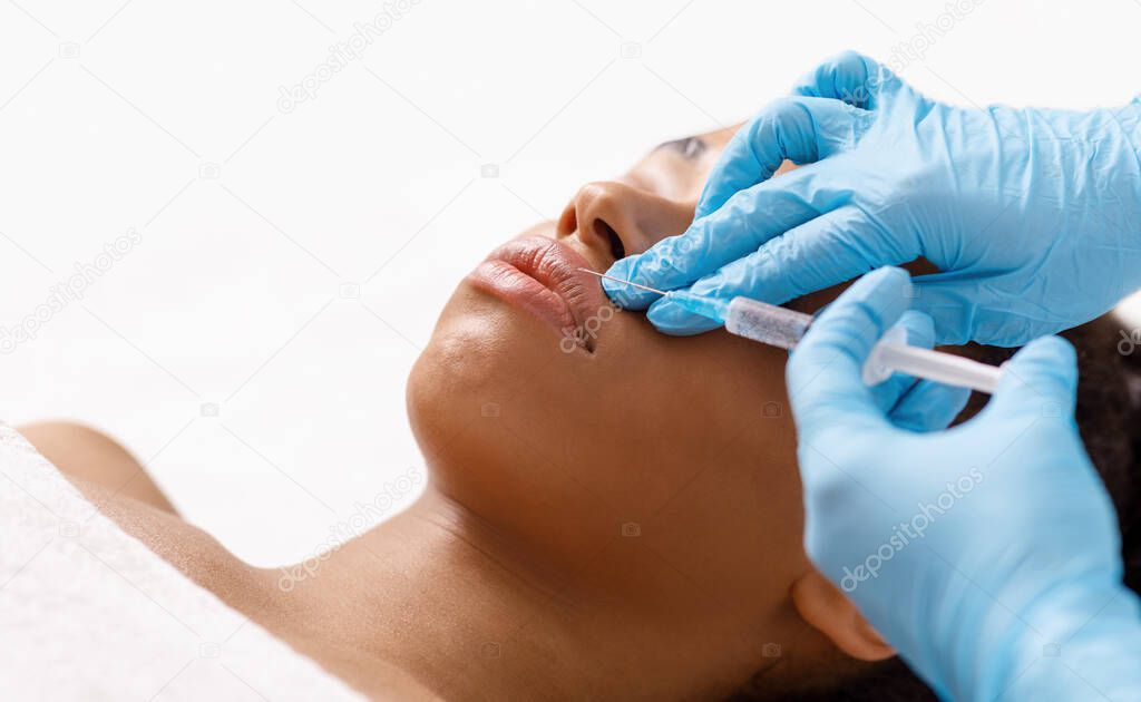 Botox lip flip for young african woman