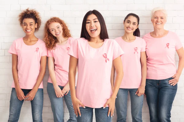 Happy Korean Girl Standing With Support Group On White Background — Stock Photo, Image