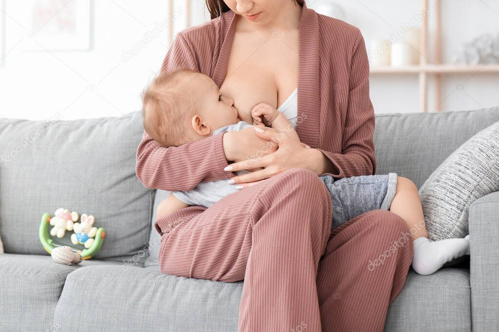 Lactation Concept. Mother Breastfeeding Her Toddler Son At Home, Cropped Image