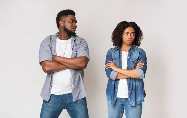 African guy looking with reproach to his girlfriend after their argue — Stock Photo, Image