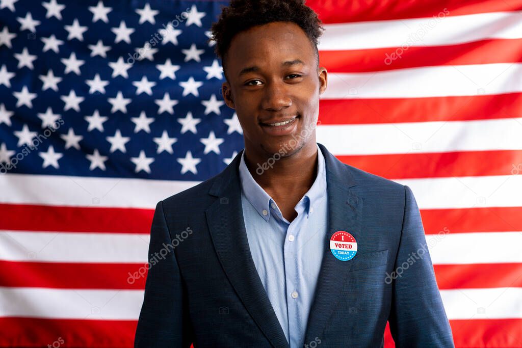 African american patriot man pinned vote button on suit