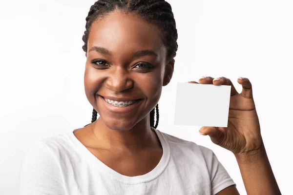 Black Woman in Braces Showing Card, White Background, Mockup — стокове фото