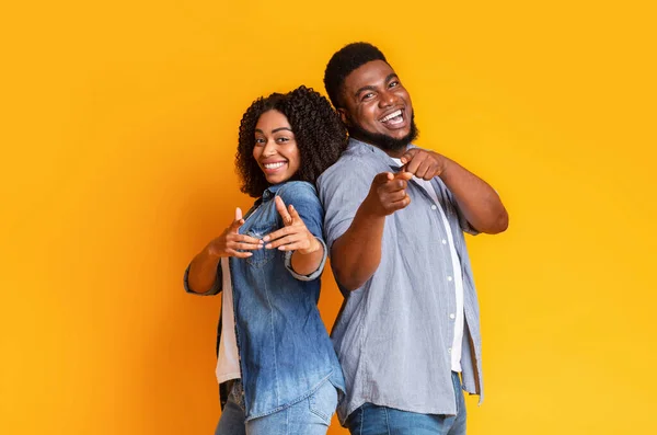 Cheerful African American Couple Standing Back To Back And Pointing At Camera — Stock Photo, Image