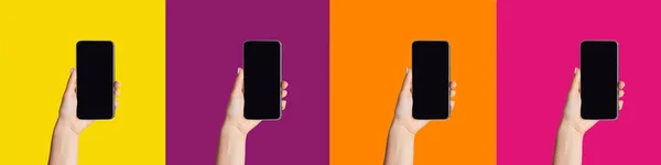 Mujeres jóvenes mostrando teléfonos celulares con pantallas en blanco sobre fondo colorido, maqueta para el diseño —  Fotos de Stock