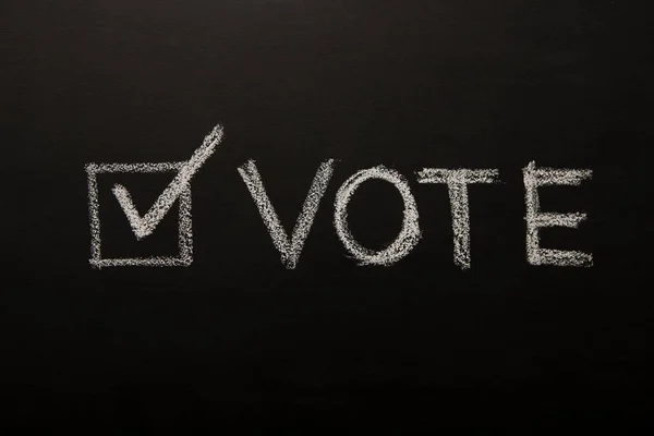 Vote tick on chalkboard, black background, elections 2020 — 스톡 사진