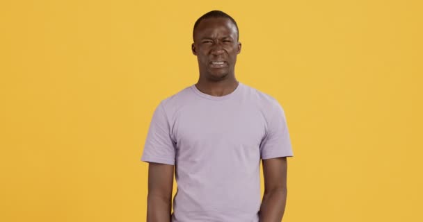 Black guy smelling something awful, closing nose — Stock Video