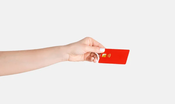 Millennial woman holding contactless credit card on white background, close up of hand — Stock Photo, Image