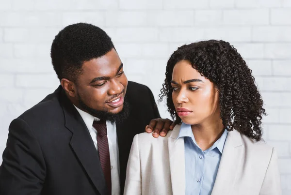 Sexual harassment in office. Male boss touching his disgusted female subordinate at workplace — Stock Photo, Image