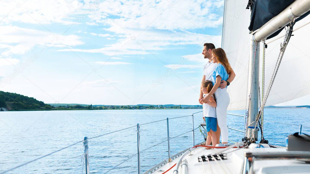 Family Of Three Enjoying Yacht Ride Standing On Boat Outdoors